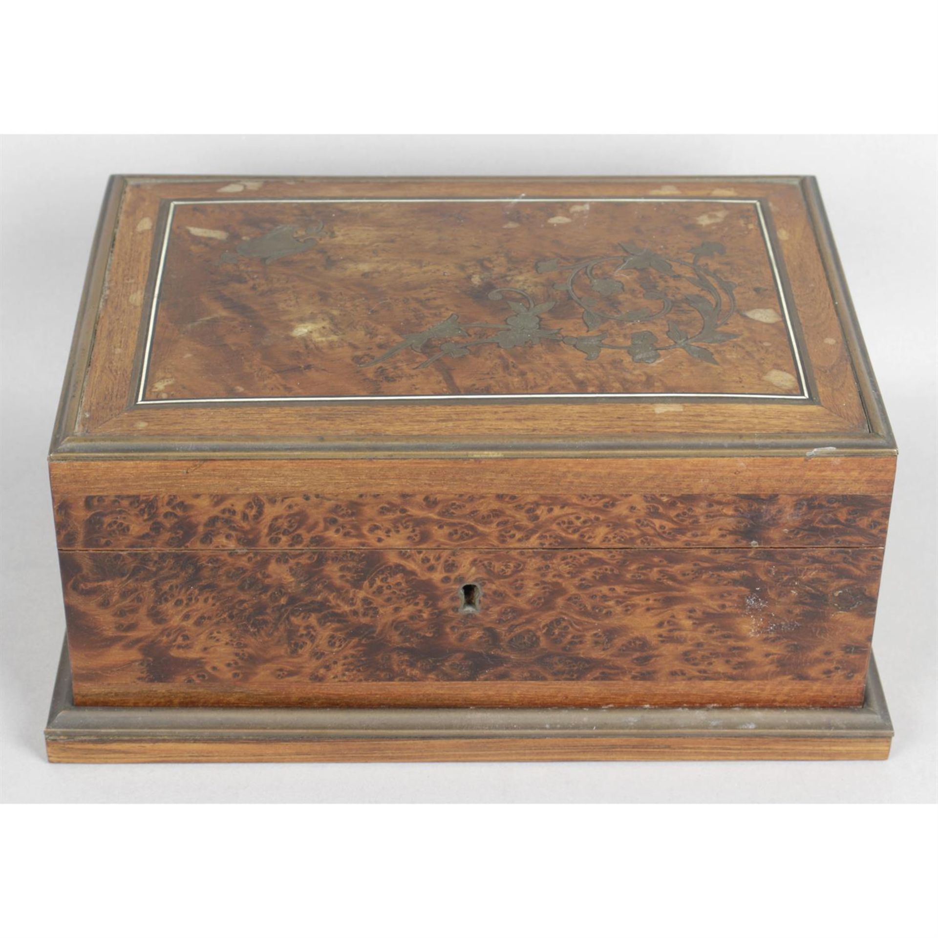 An early 20th century brass inlaid and burr wood ladies dressing table box.