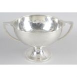 A large 1920's silver twin-handled pedestal bowl.