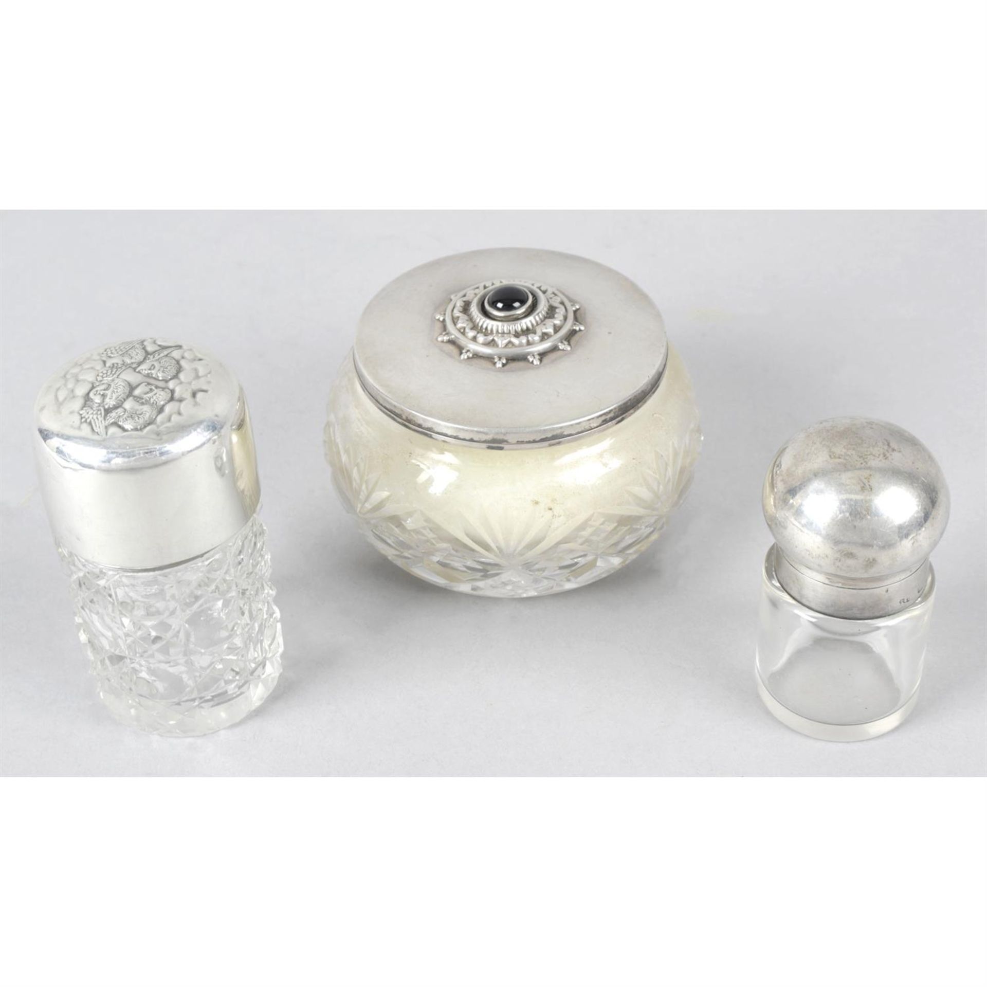 Two silver topped glass perfume bottles, a silver mounted ring tree (a.f), a bud vase (filled base),