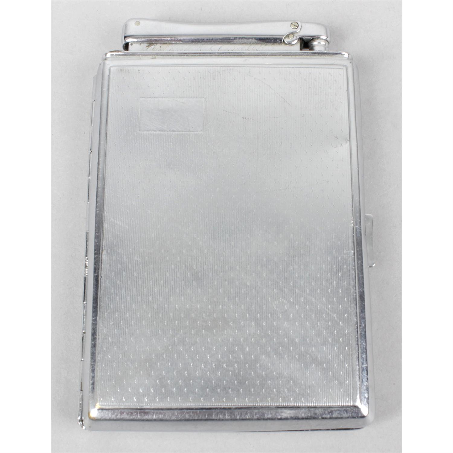 A Colibri metal cigarette case with incorporated lighter.