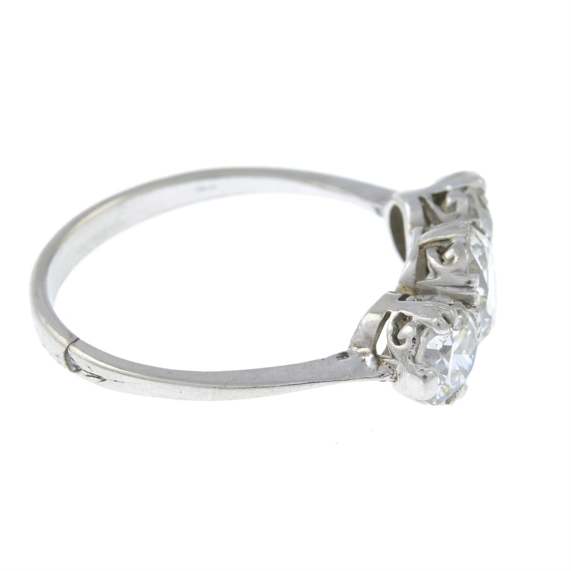 A mid 20th century platinum, graduated diamond three stone ring. - Image 4 of 6
