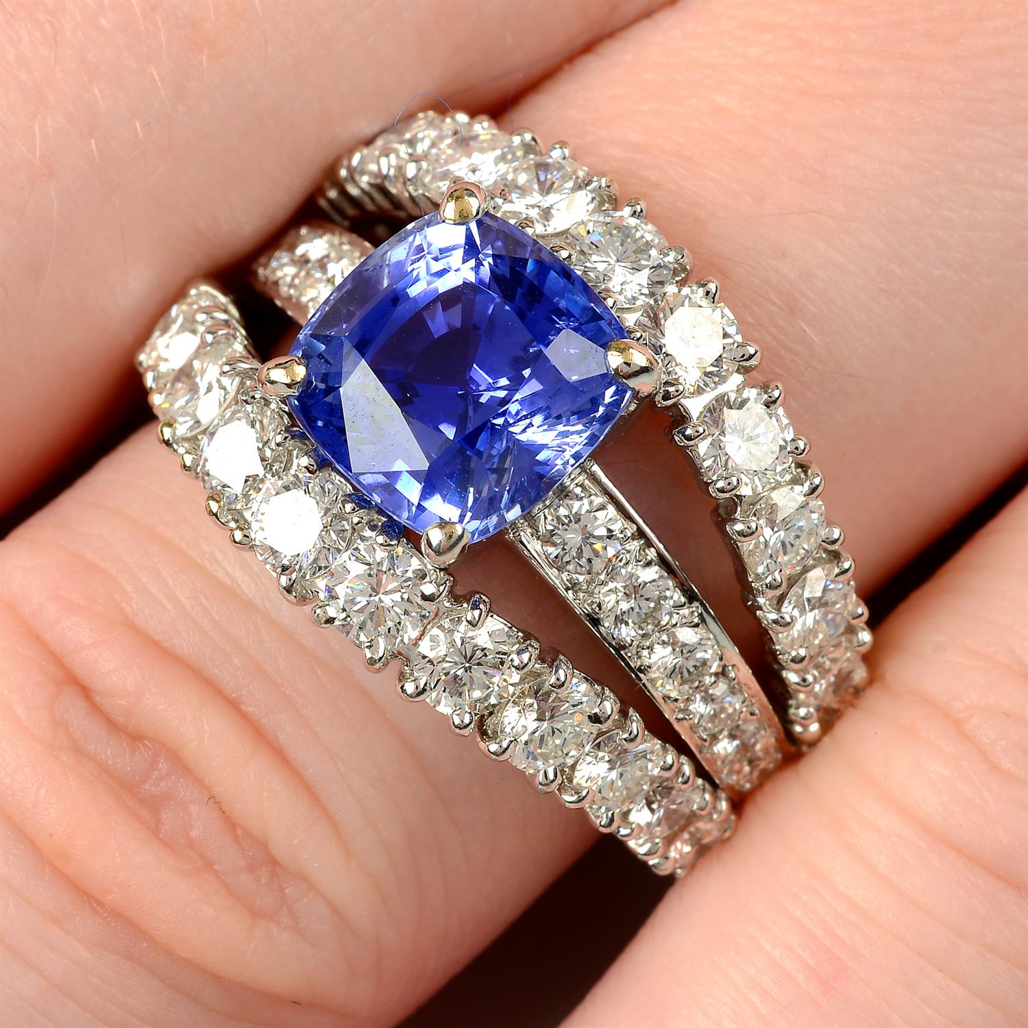 An 18ct gold no-heat sapphire and brilliant-cut diamond dress ring, by Ritz Fine Jewellery.