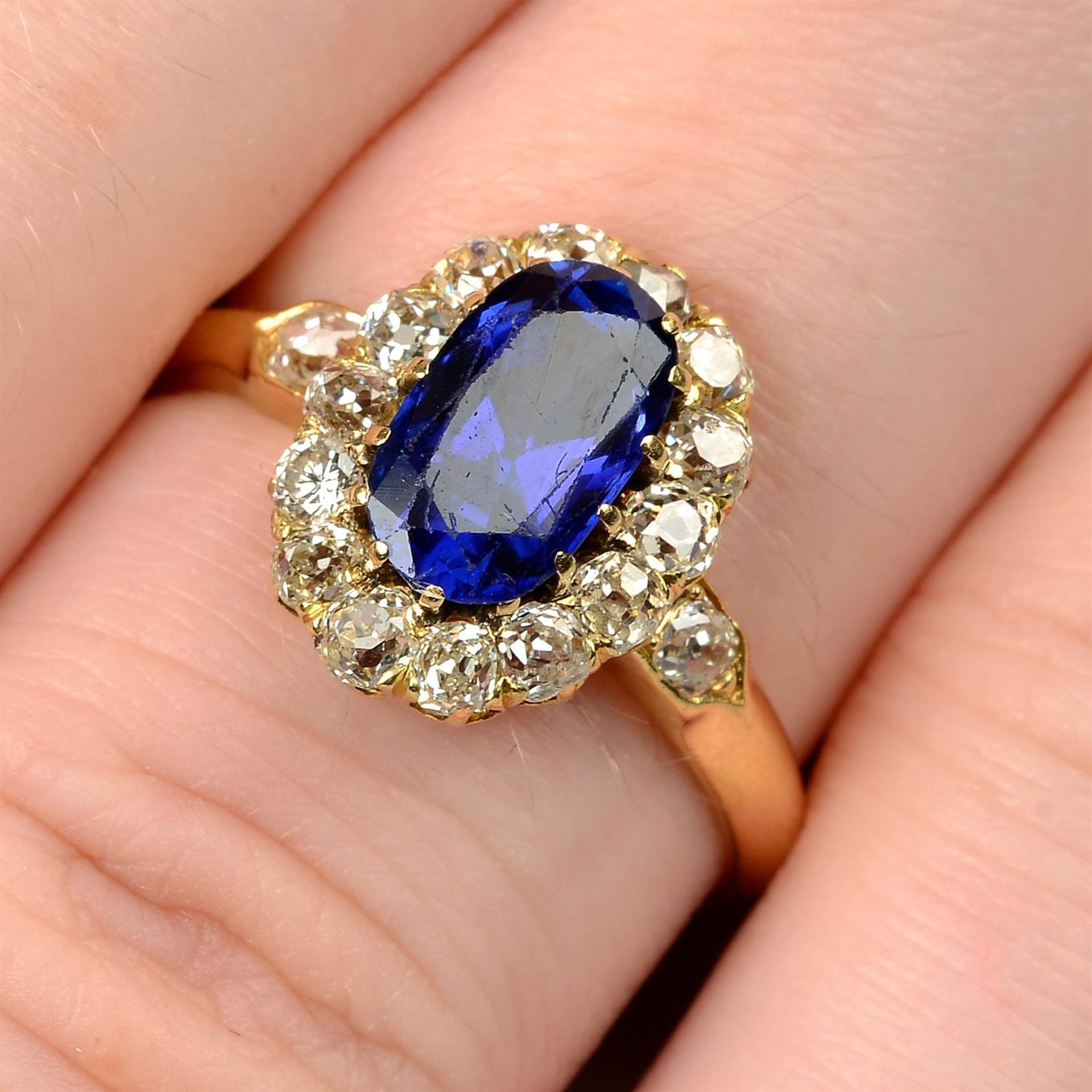 A late Victorian 18ct gold Sri Lankan sapphire and old-cut diamond cluster ring.