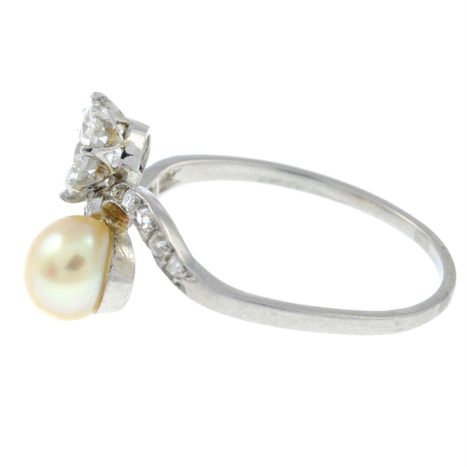 An early 20th century platinum, circular-cut diamond and pearl crossover ring. - Image 3 of 6