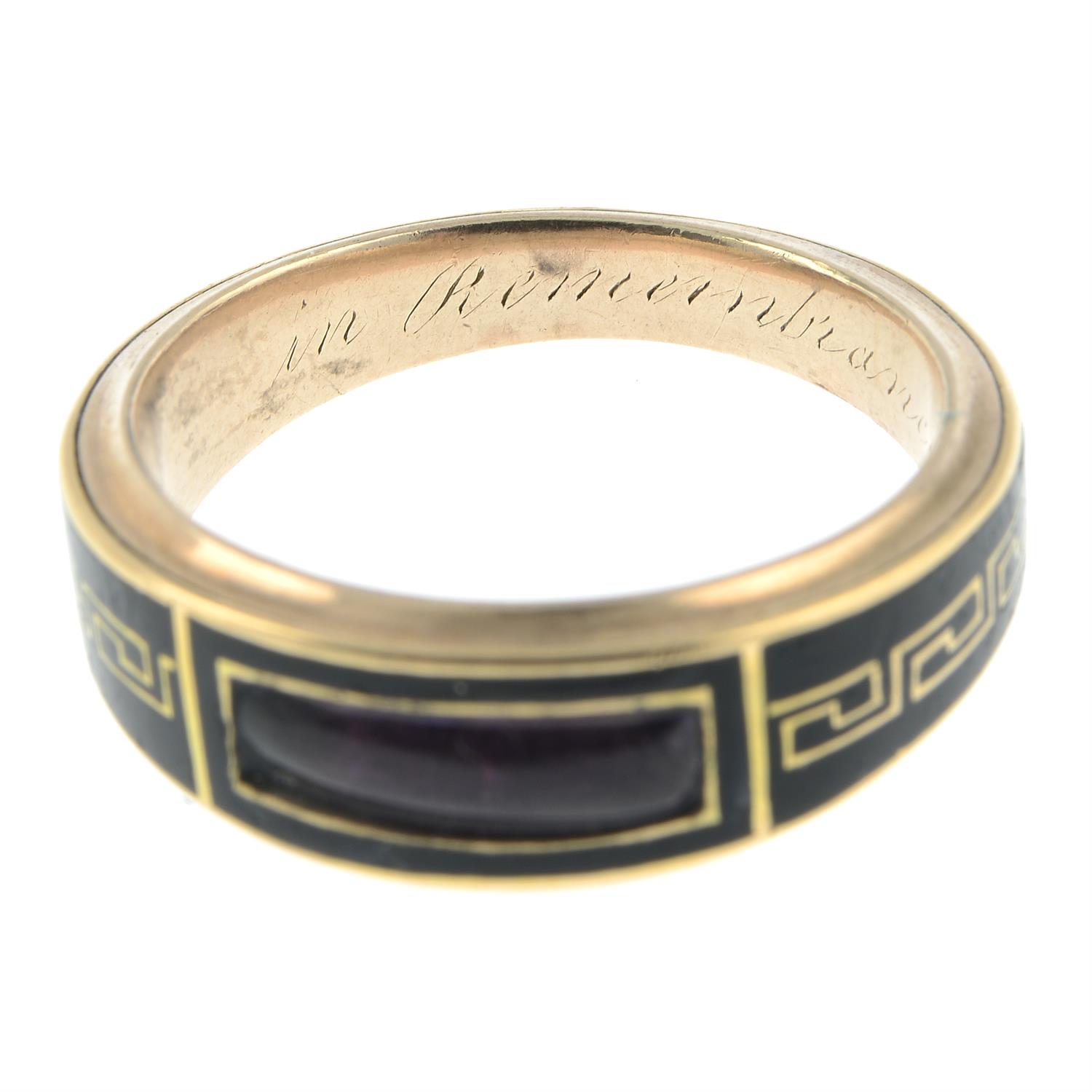 A late Georgian 9ct gold, Greek-key black enamel and foil back amethyst tapered mourning ring. - Image 5 of 6