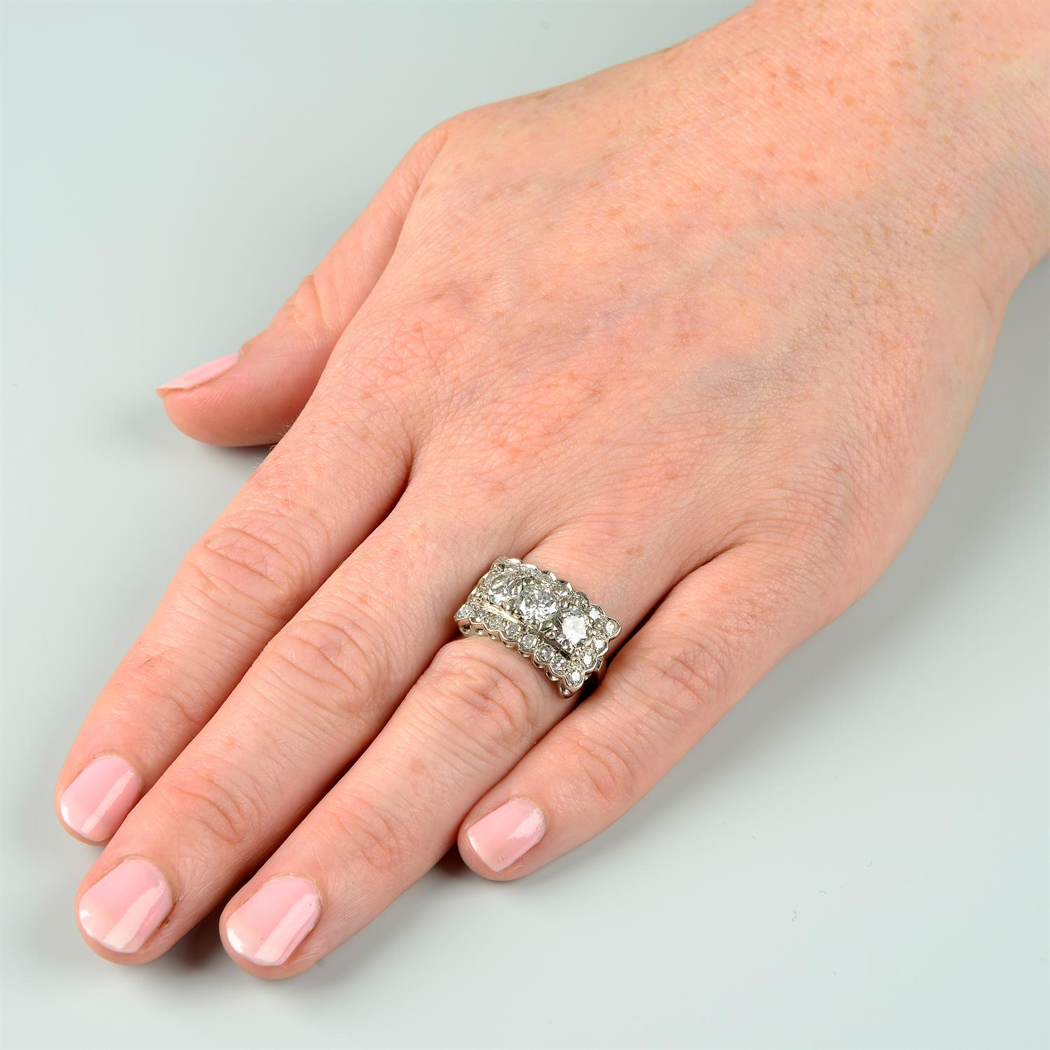 A brilliant-cut diamond three-stone ring, with single-cut diamond shared surround. - Image 6 of 6