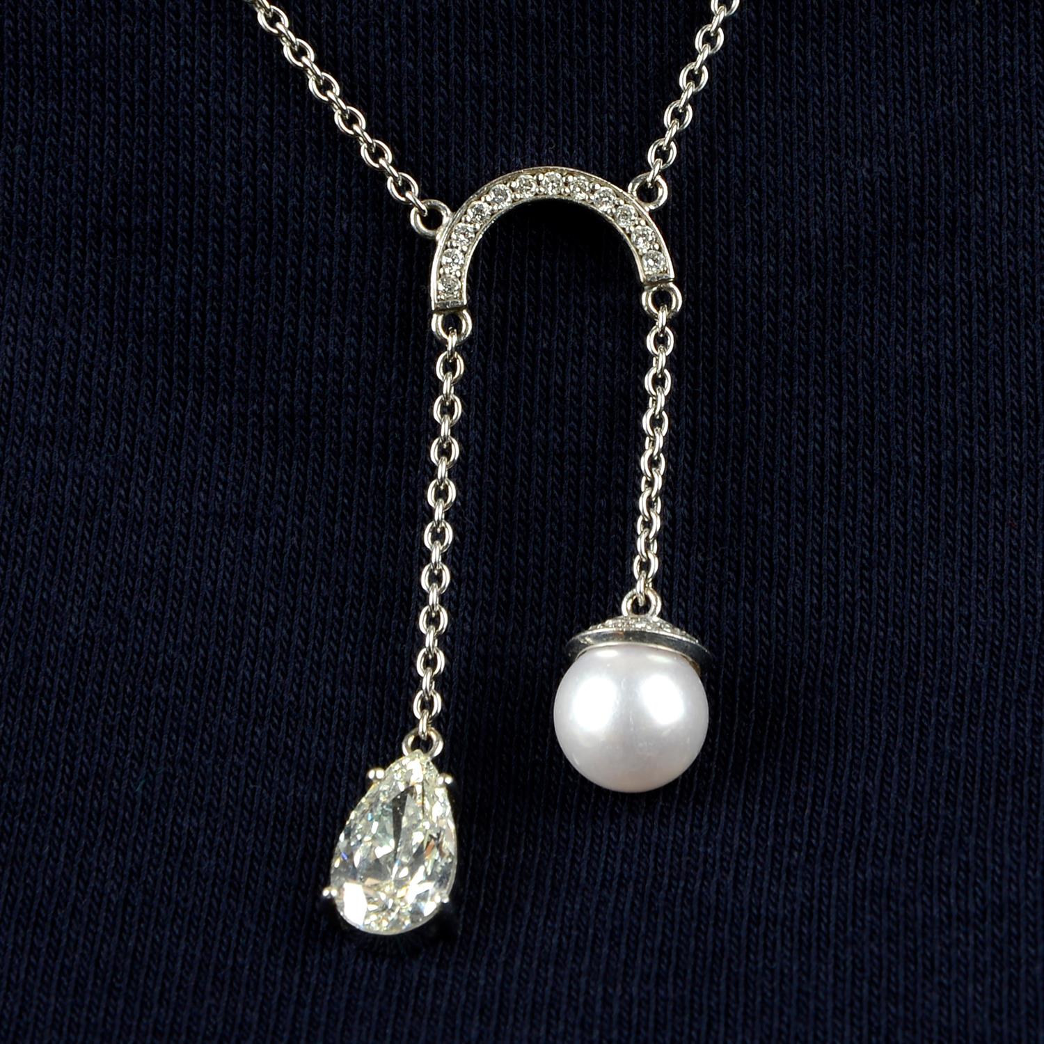 An 18ct gold diamond and cultured pearl negligée pendant, on chain.