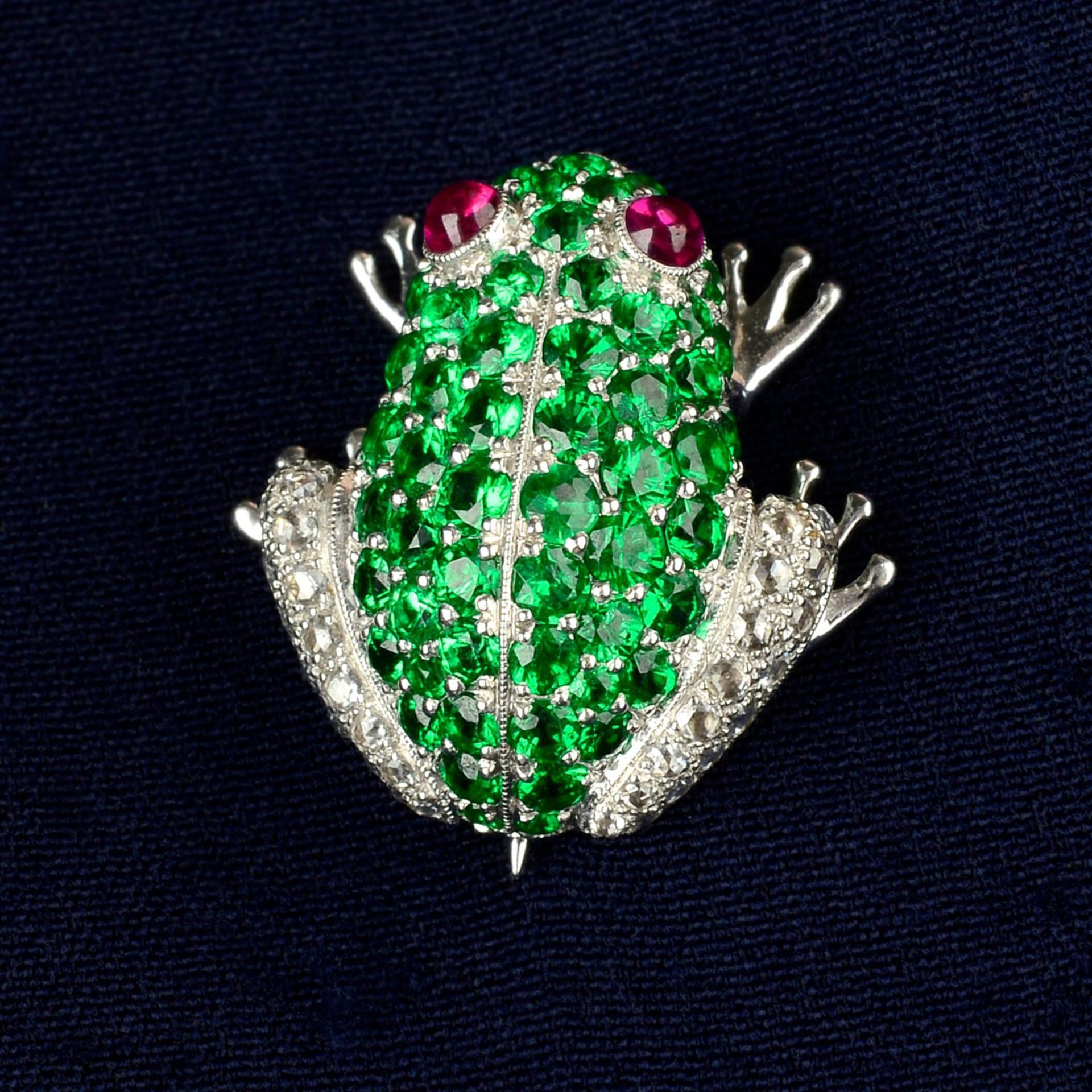 A tsavorite garnet and rose-cut diamond frog brooch, with ruby cabochon eyes.