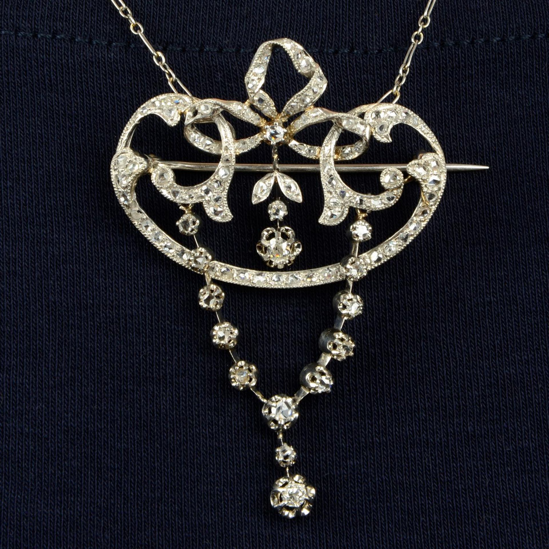 A Belle Époque platinum, old and rose-cut diamond brooch/pendant, with detachable chain.