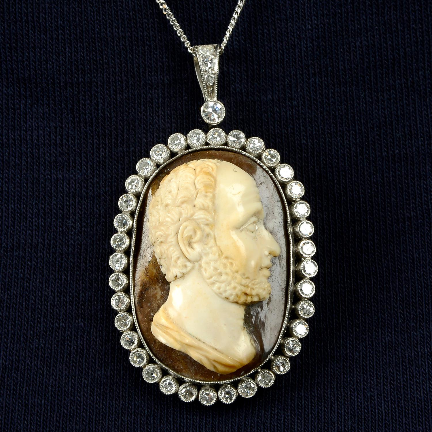 A hardstone cameo pendant, with single-cut diamond surround and surmount.