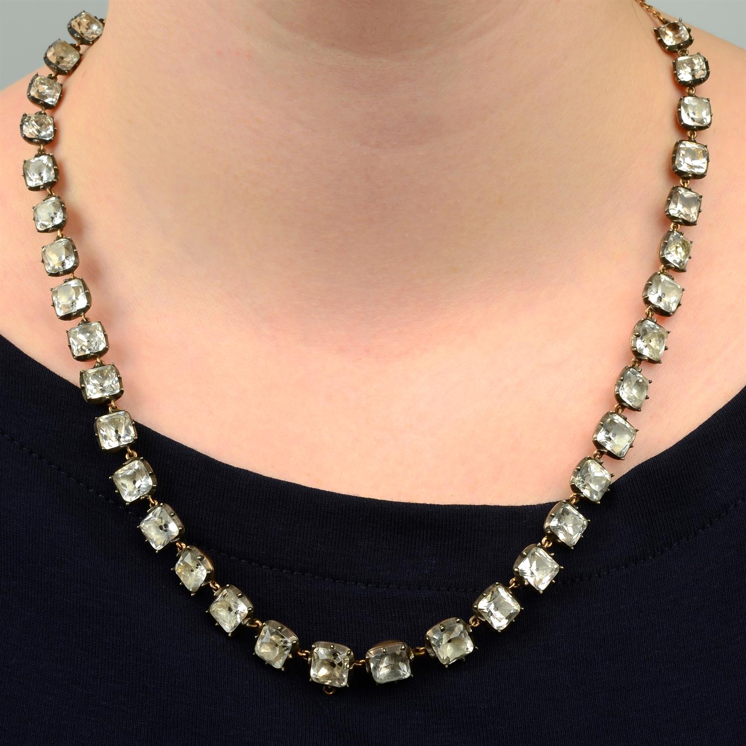 A Georgian 'black dot' foil-back rock crystal necklace, with later back-chain extension.