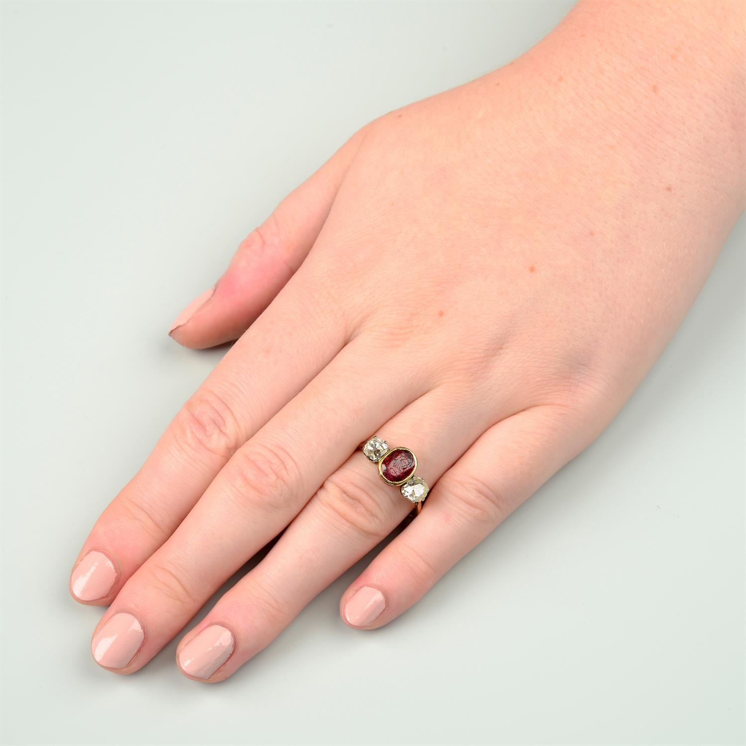 A ruby and diamond three-stone ring. - Image 6 of 6