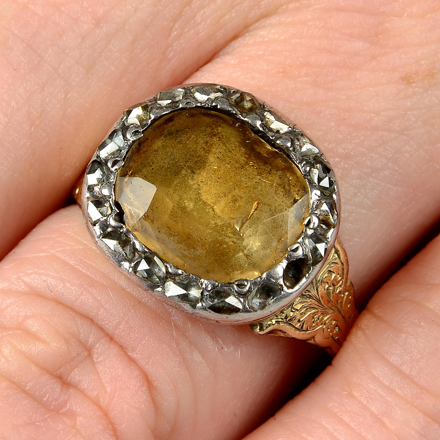 A late Georgian silver and gold, foil back golden topaz and rose-cut diamond ring.