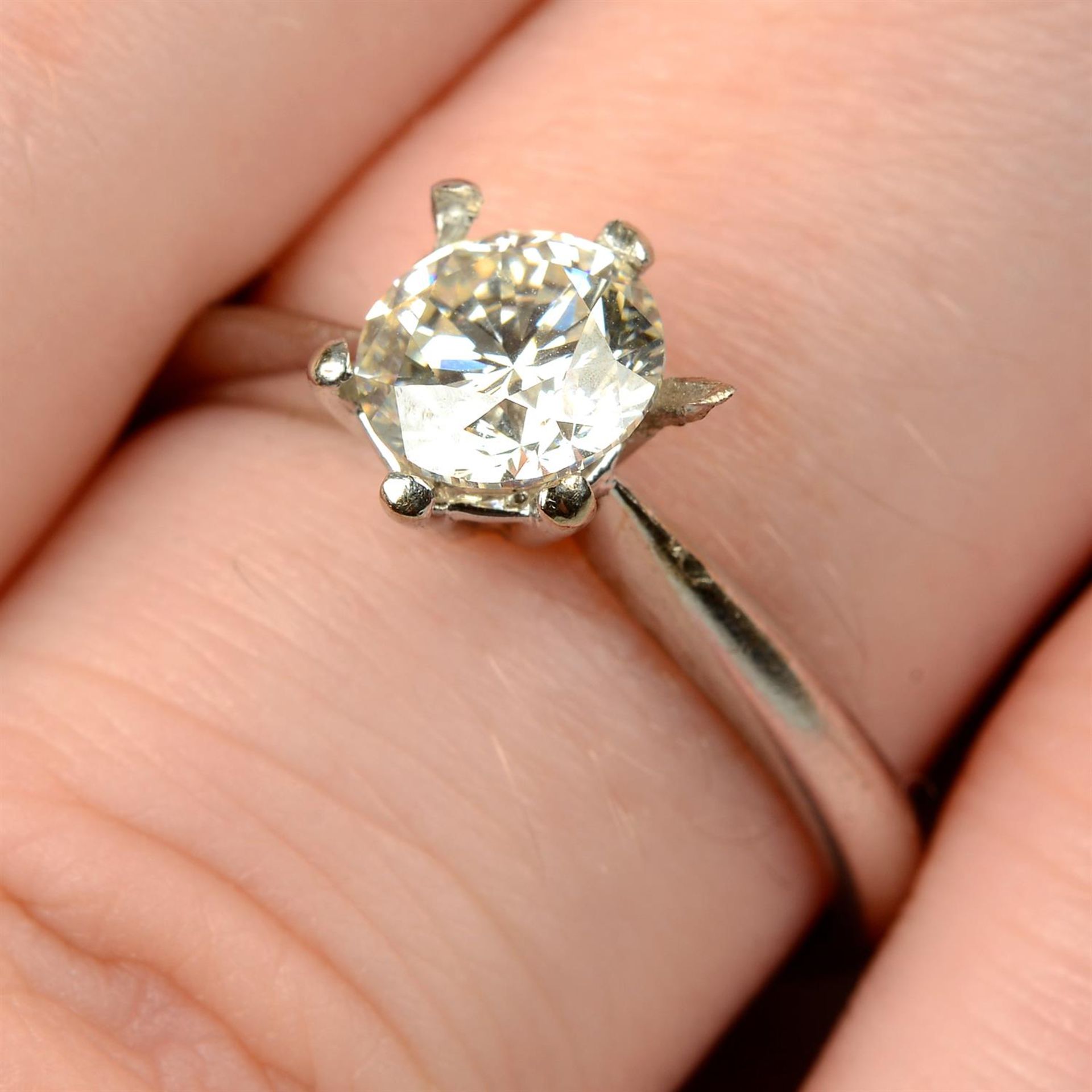 A brilliant-cut diamond, with 18ct gold ring mount.