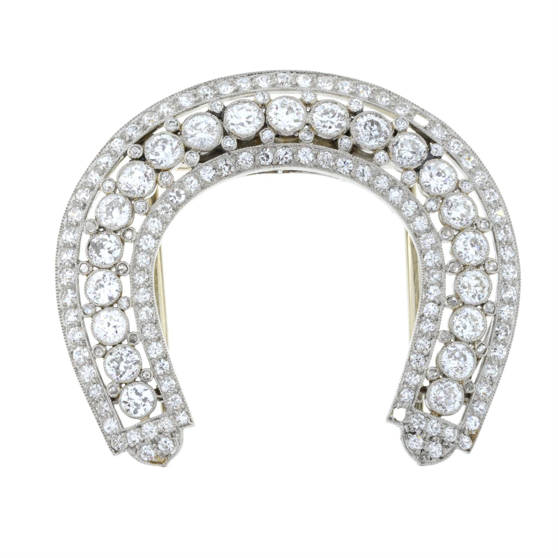 An early 20th century platinum diamond horseshoe-shape clip, by Cartier. - Bild 2 aus 4