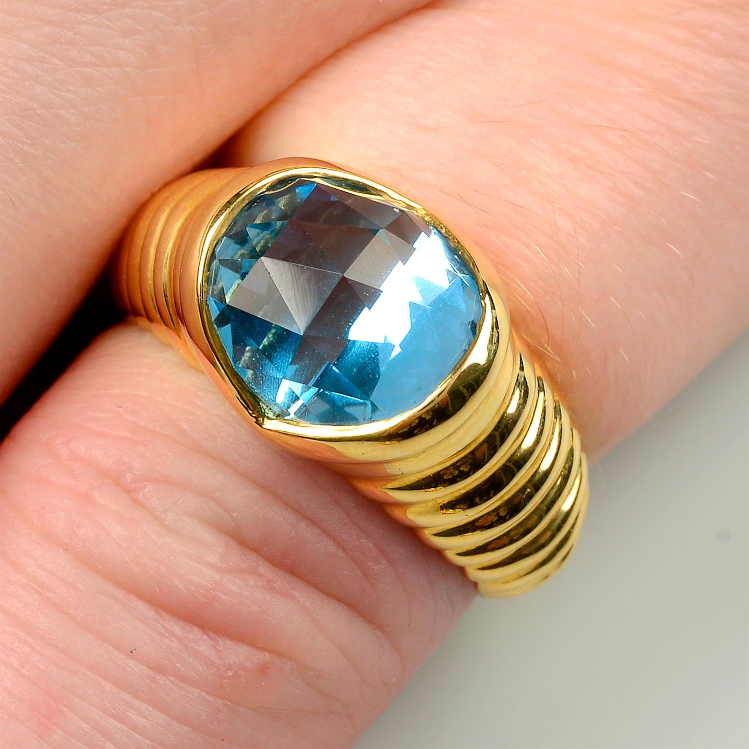 A blue topaz ring, by Bulgari.