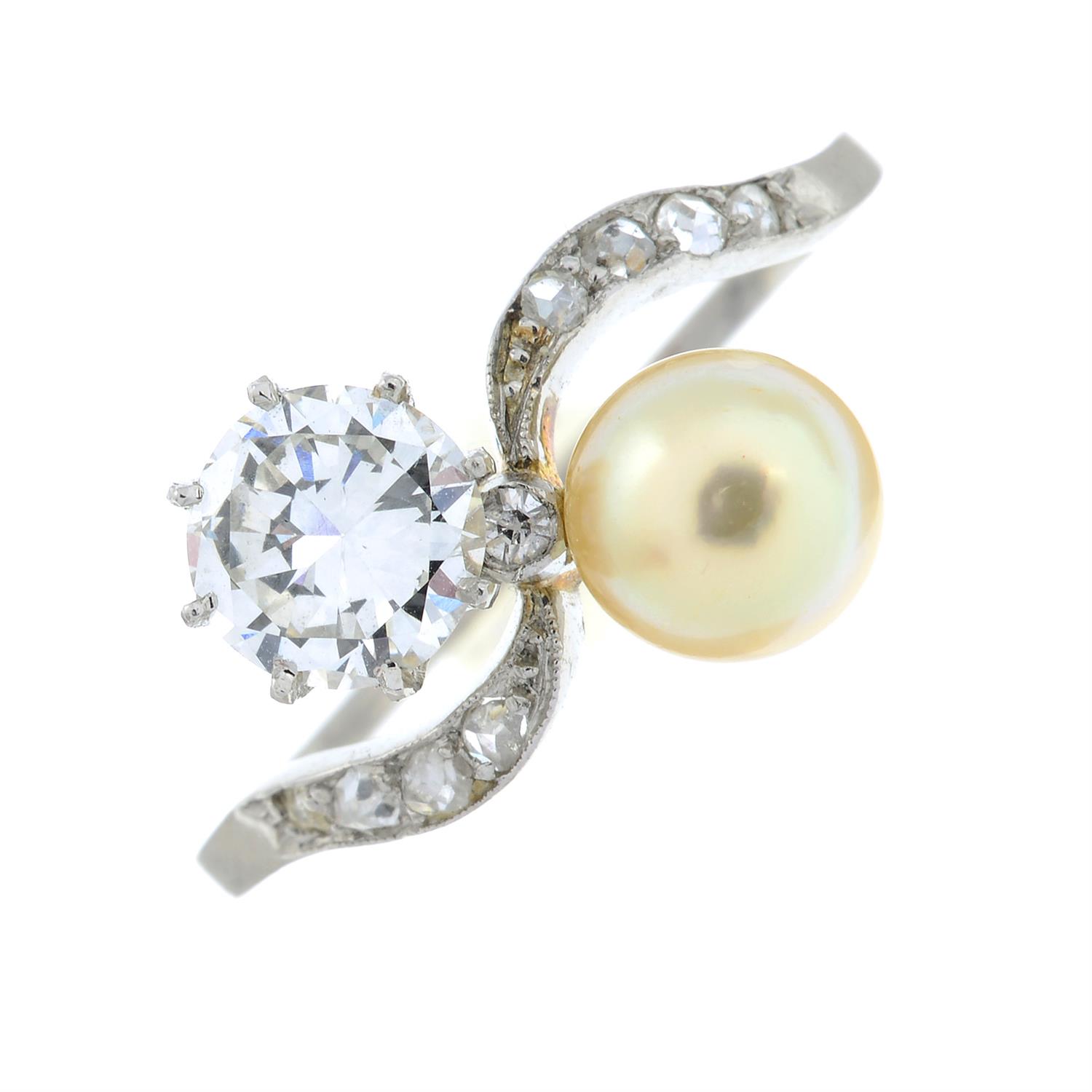 An early 20th century platinum, circular-cut diamond and pearl crossover ring. - Image 2 of 6