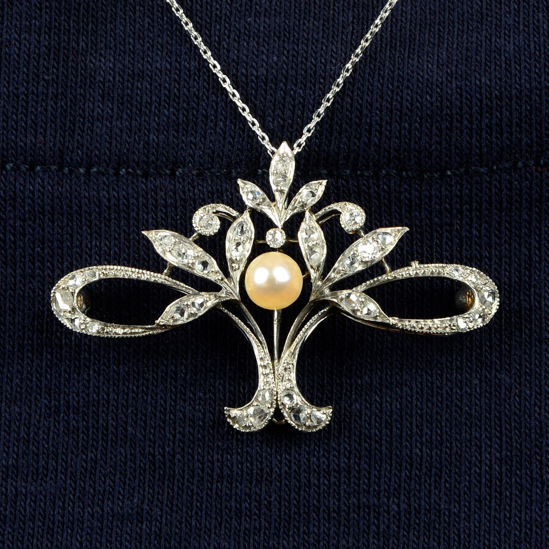 A Belle Époque platinum, pearl and diamond pendant, with later chain.