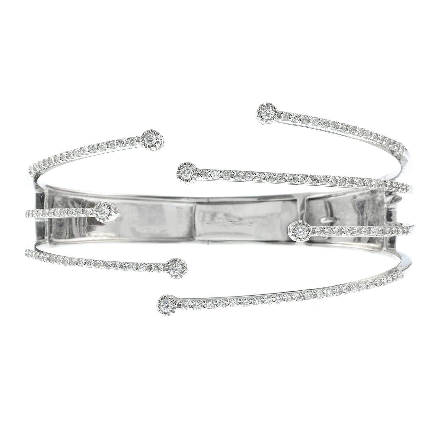 A brilliant-cut diamond open hinged bangle. - Image 2 of 5