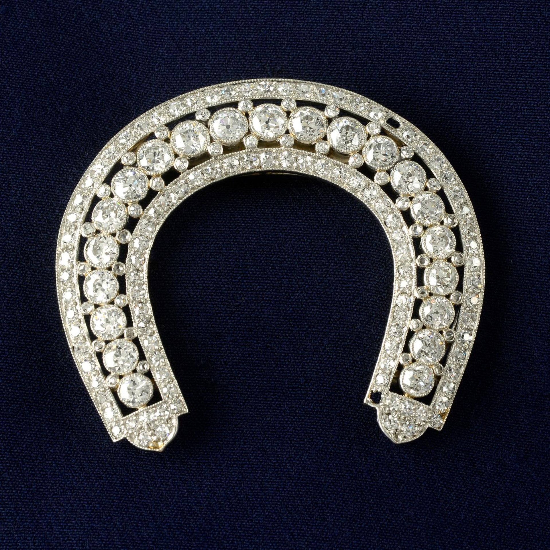 An early 20th century platinum diamond horseshoe-shape clip, by Cartier.