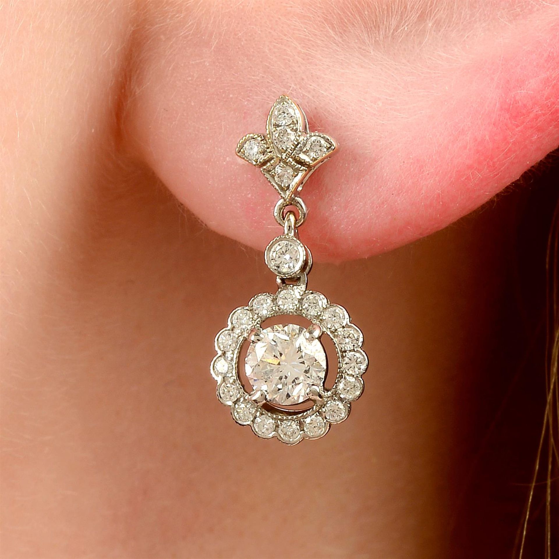 A pair of 18ct gold brilliant-cut diamond cluster drop earrings.