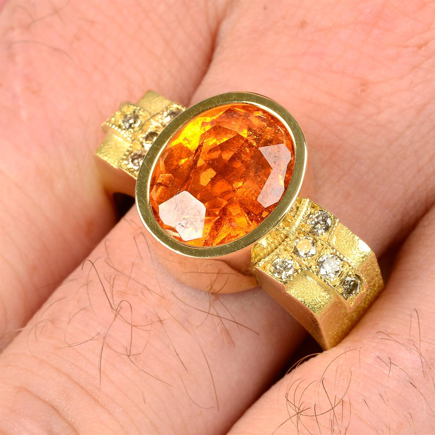 A spessartine garnet and 'brown' diamond ring, by Erwin Springbrunn.