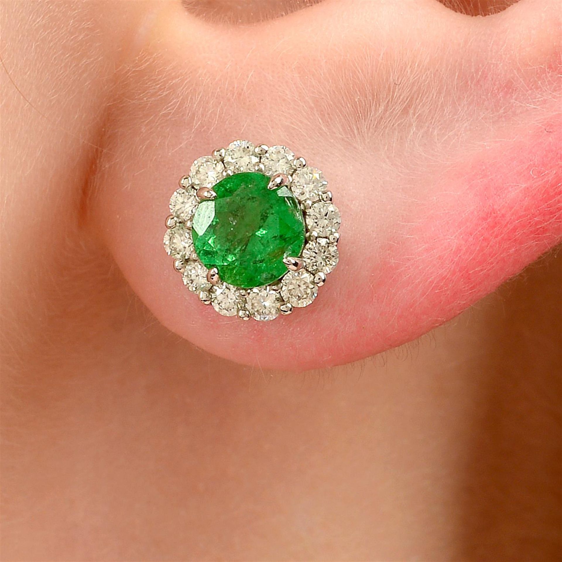 A pair of green garnet and brilliant-cut diamond cluster earrings.