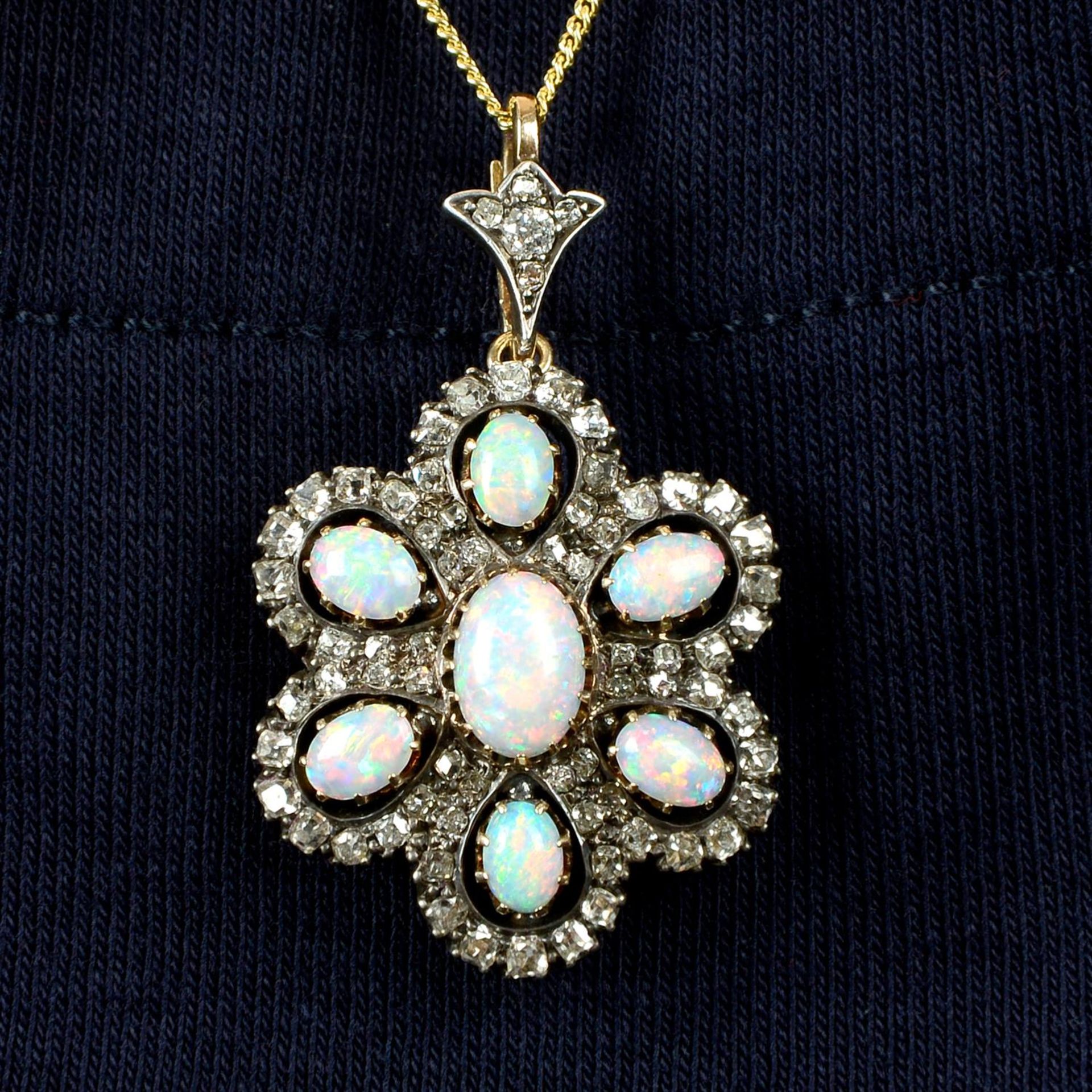 A late Victorian silver and gold, opal and old-cut diamond floral cluster pendant.