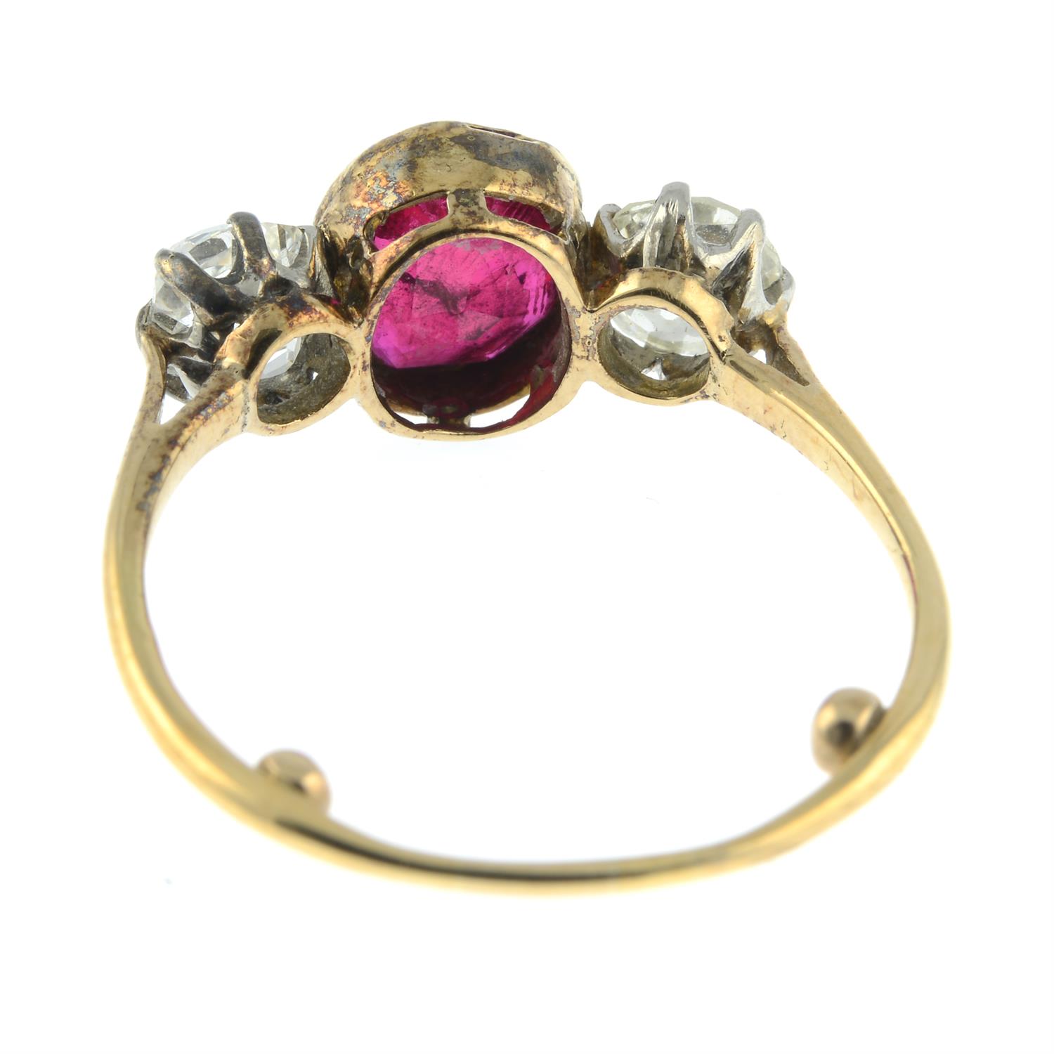 A ruby and diamond three-stone ring. - Image 4 of 6