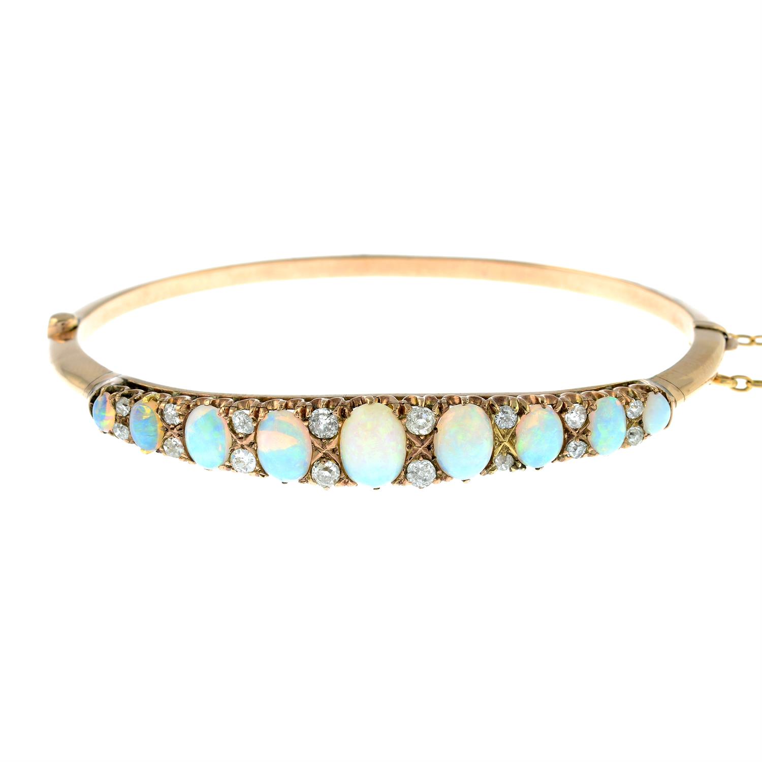 A late Victorian 9ct gold graduated opal hinged bangle, with old-cut diamond spacers. - Image 2 of 7