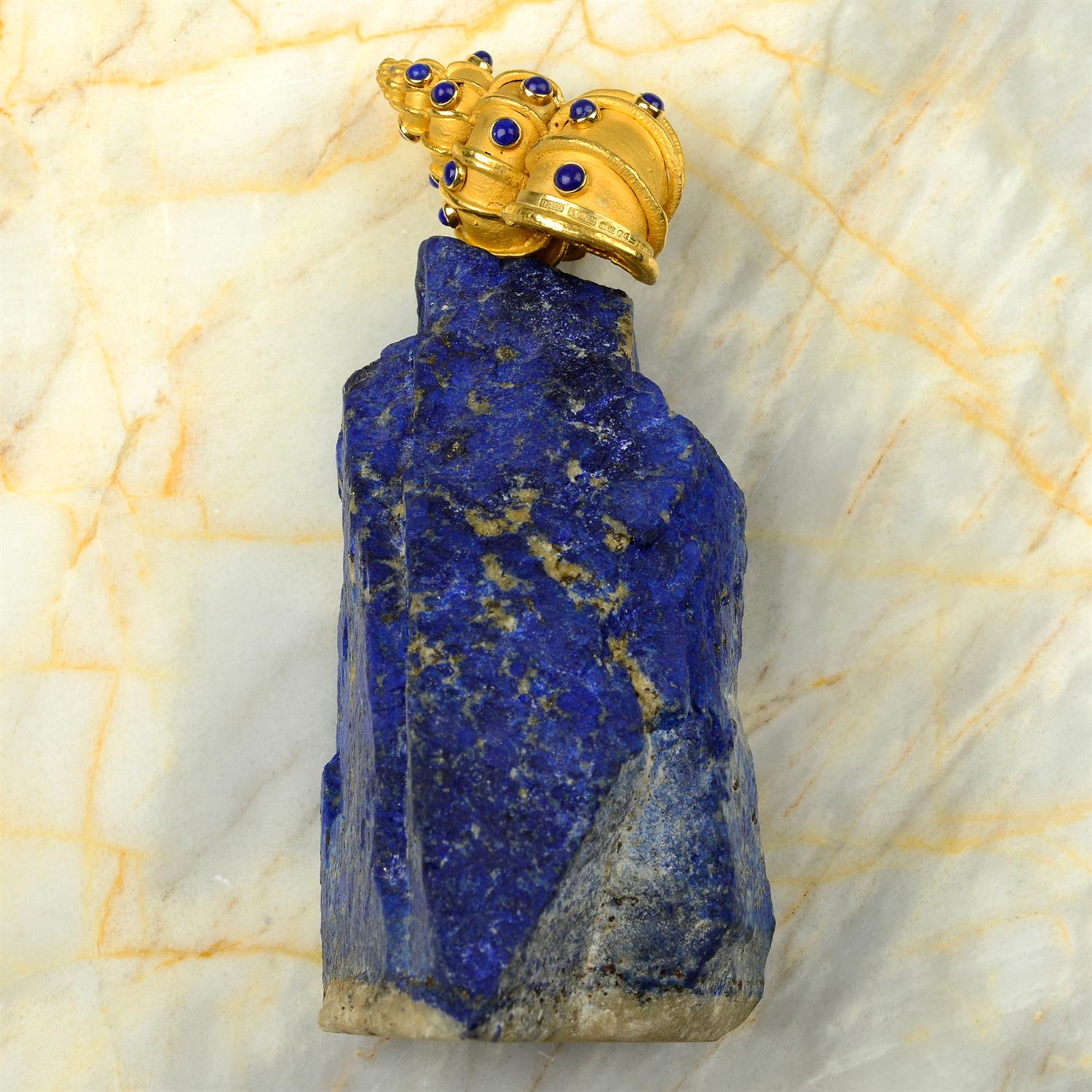 An 18ct gold lapis lazuli 'Supershells' objet d'art, of a snail atop an outcrop, by Grima.