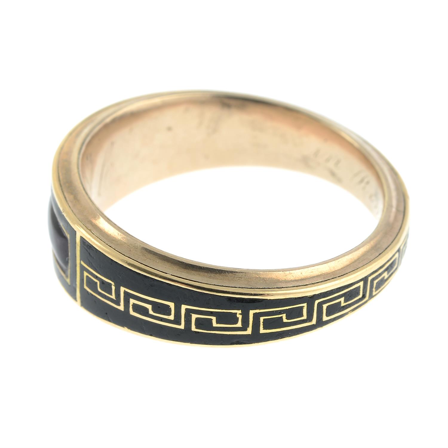 A late Georgian 9ct gold, Greek-key black enamel and foil back amethyst tapered mourning ring. - Image 3 of 6