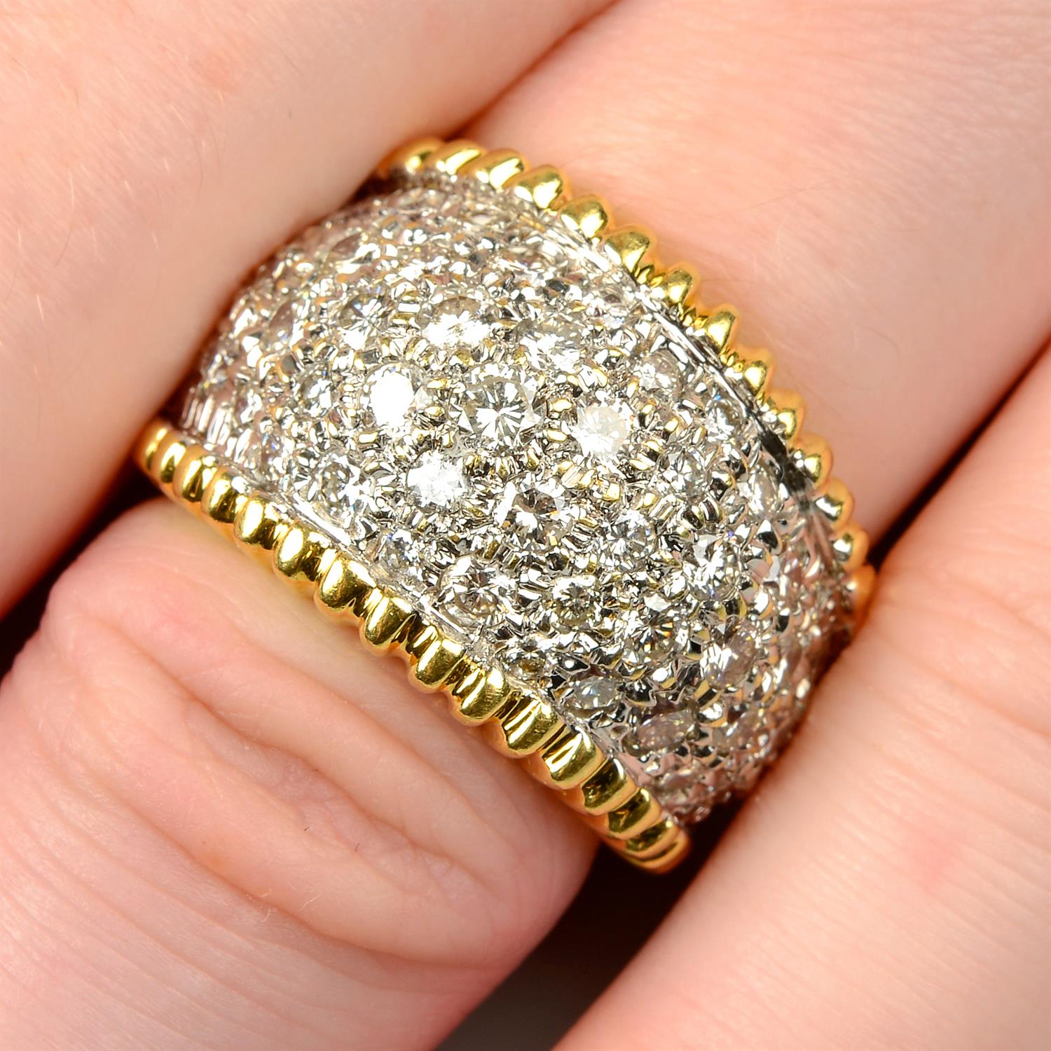 An 18ct gold pavé-set diamond tapered ring.