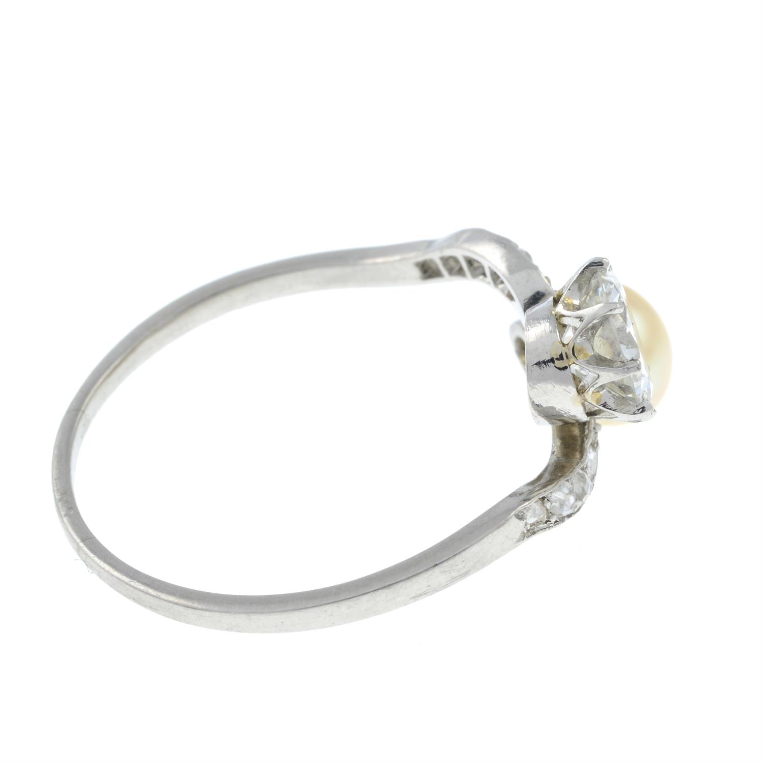 An early 20th century platinum, circular-cut diamond and pearl crossover ring. - Image 4 of 6