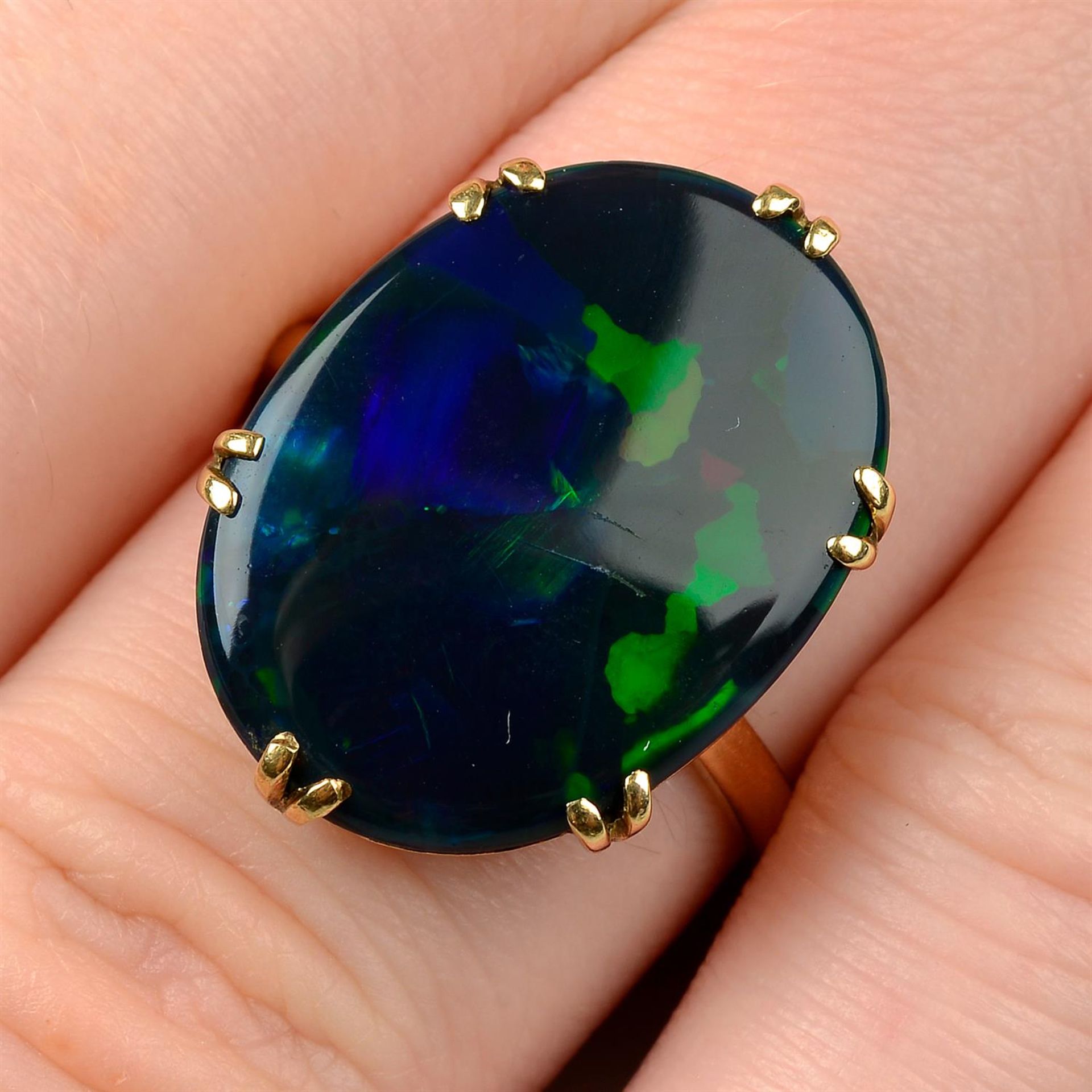 A black opal single-stone ring.