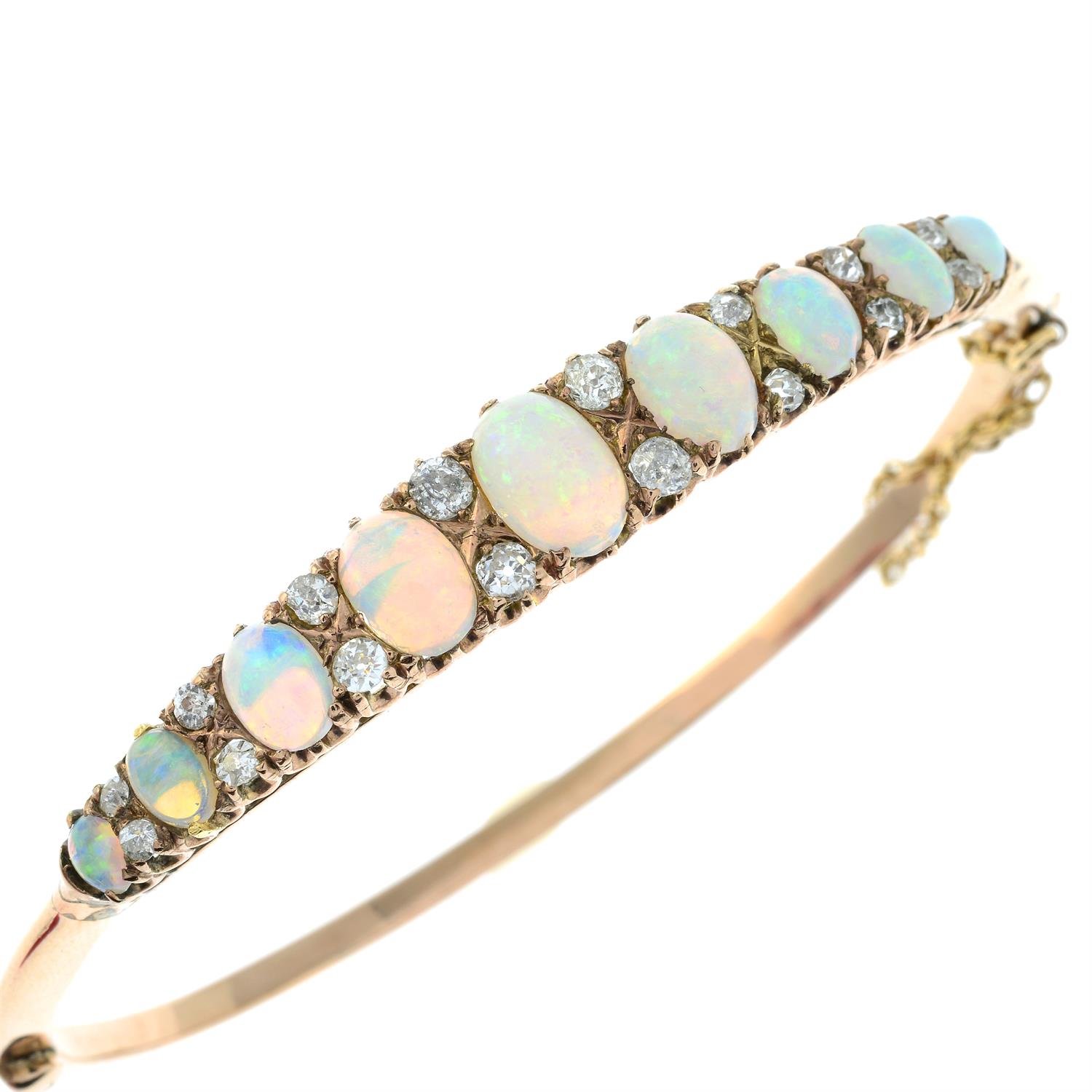 A late Victorian 9ct gold graduated opal hinged bangle, with old-cut diamond spacers. - Image 5 of 7