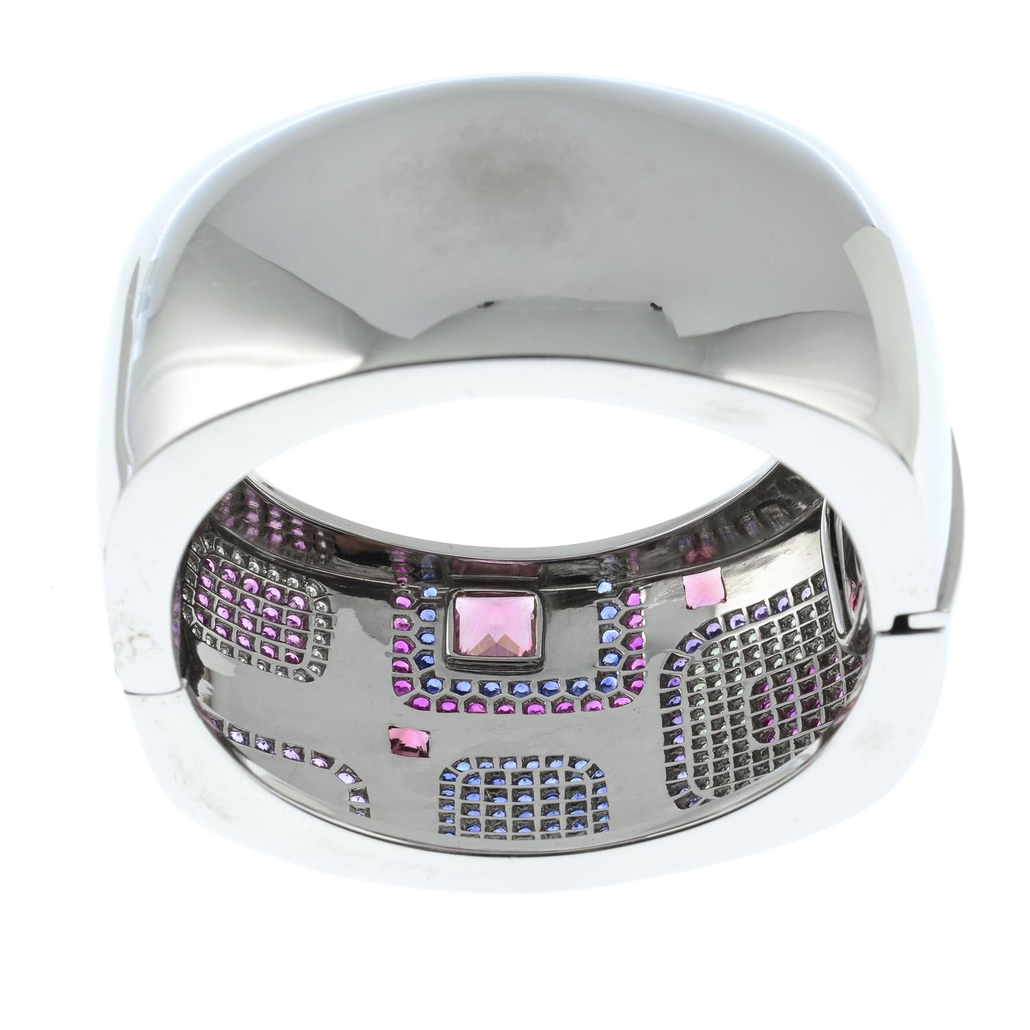 An 18ct gold, vari-hue sapphire, pink tourmaline and diamond 'Patchwork' hinged bangle, - Image 4 of 4