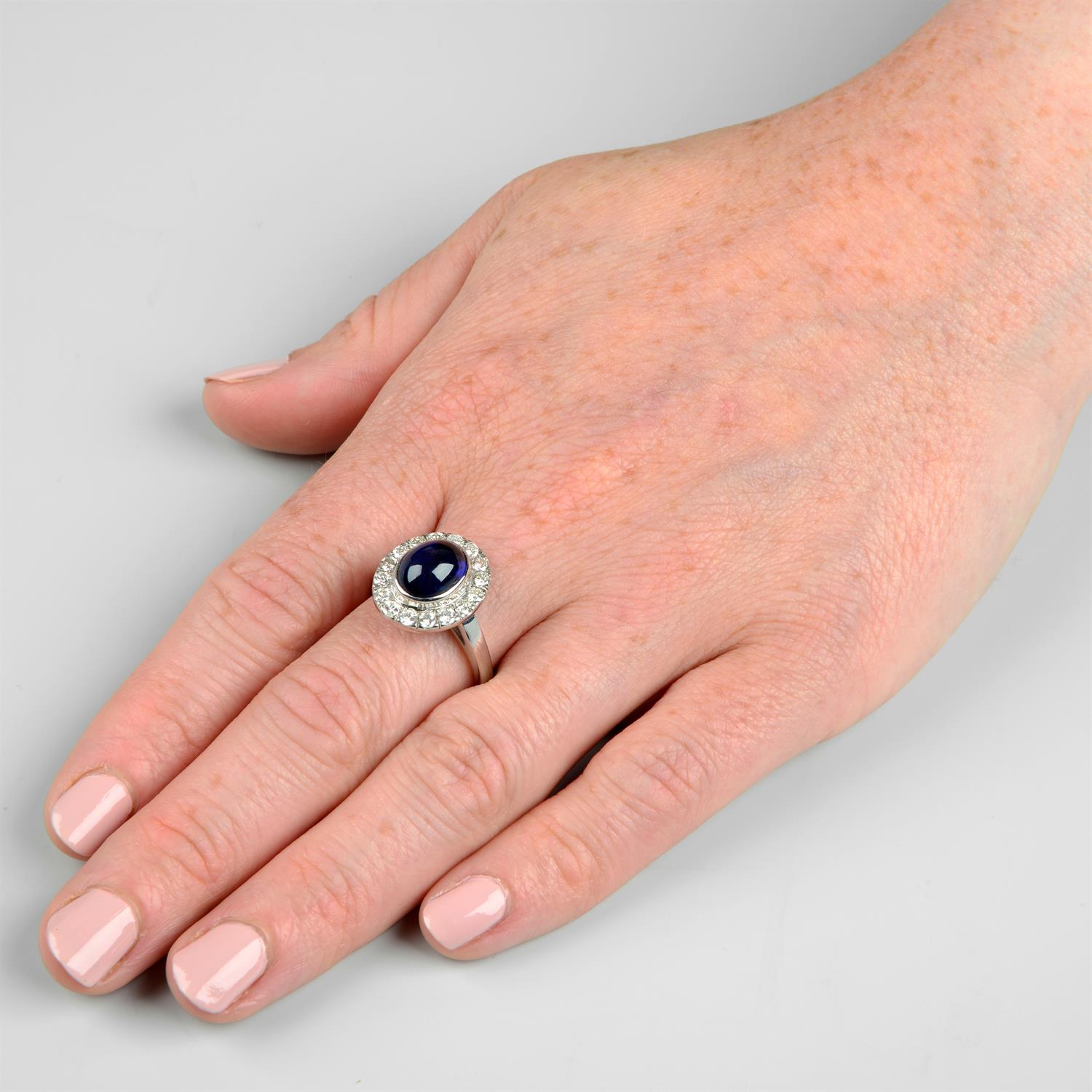 An 18ct gold sapphire cabochon and brilliant-cut diamond ring. - Image 6 of 6