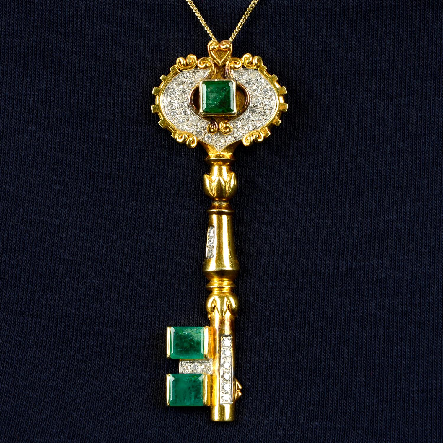 A mid 20th century gold emerald and single-cut diamond key pendant.