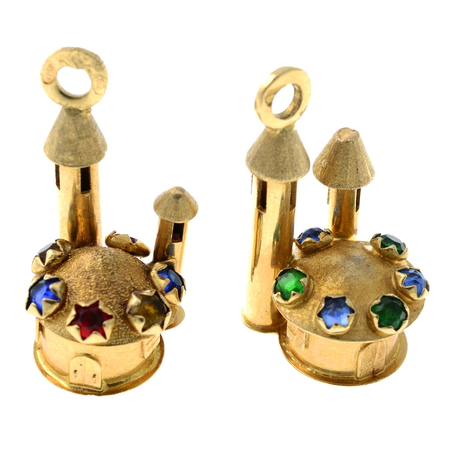 Two castle charms, each with vari-hue paste highlights.