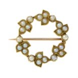 An early 20th century gold split pearl wreath brooch.