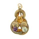 A late 19th century gold garnet and chrysoberyl cannetille pendant.