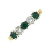 An 18ct gold emerald and brilliant-cut diamond five-stone ring.