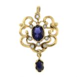 A 9ct gold iolite and brilliant-cut diamond pendant / brooch.