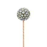 A split pearl stickpin.