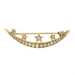 An early 20th century gold split pearl crescent and stars brooch.