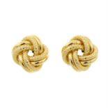 A pair of twisted knot earrings.