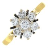 An 18ct gold brilliant-cut diamond cluster ring.