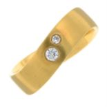 An 18ct gold undulating band ring, with brilliant-cut diamond highlights.