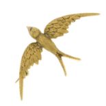 A late 19th century 15ct gold textured swallow brooch.
